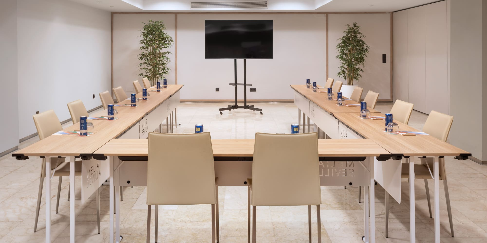 a room with a large table and chairs
