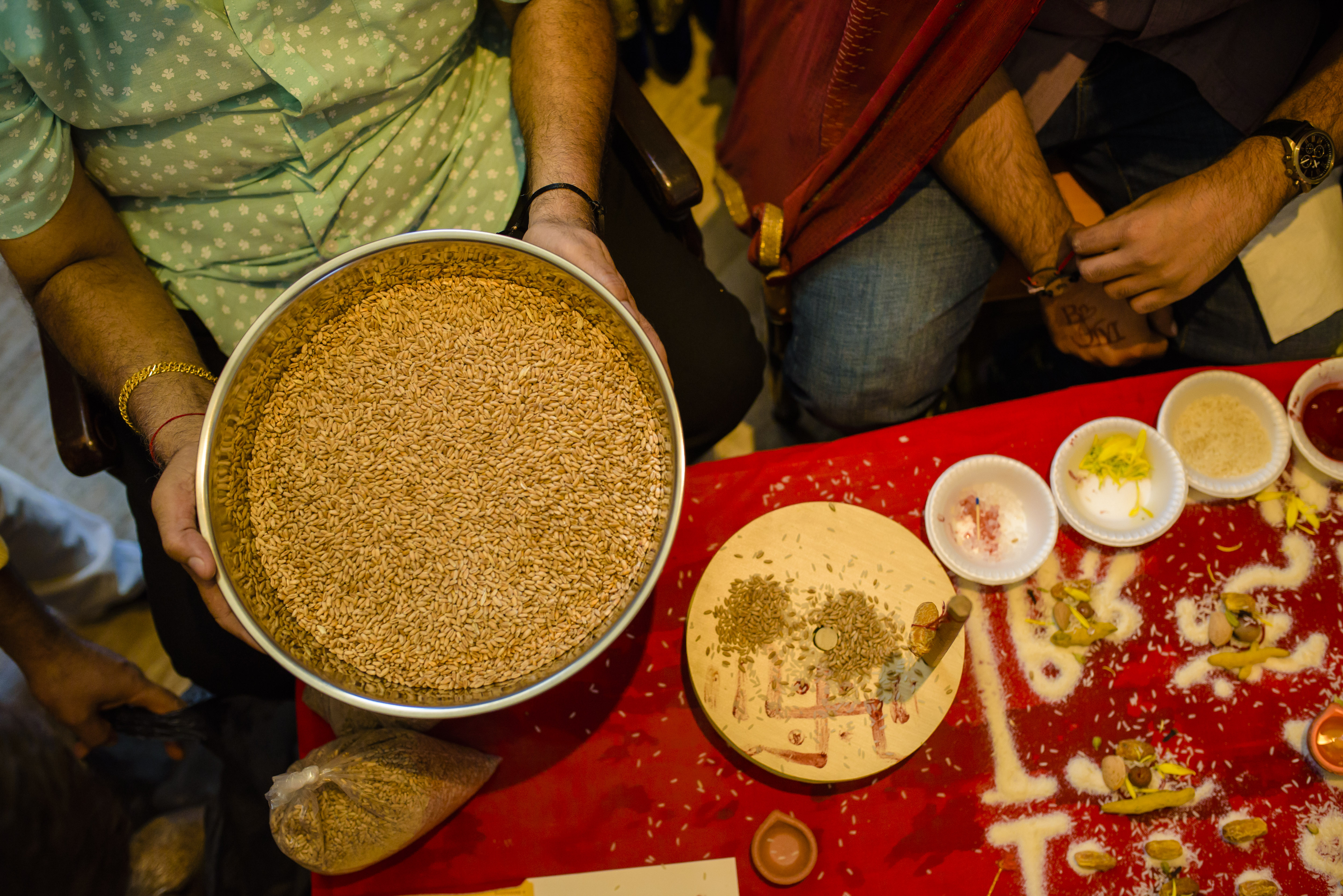 a person holding a bowl of brown rice