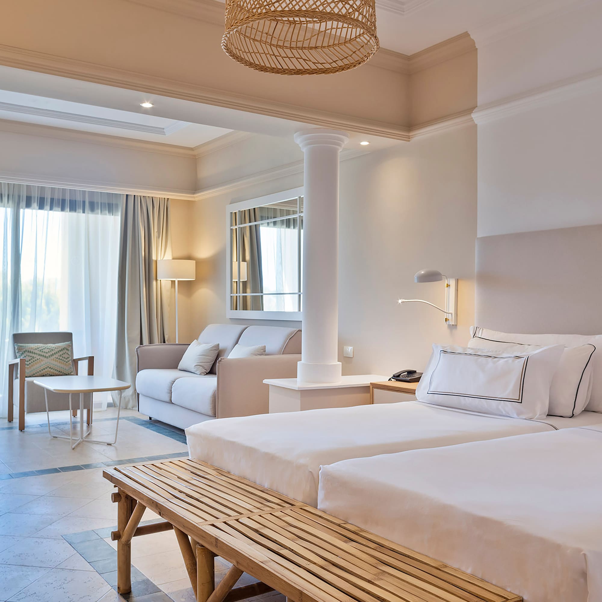 a room with a bed and couches