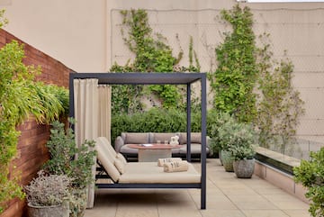 a patio with a couch and a table