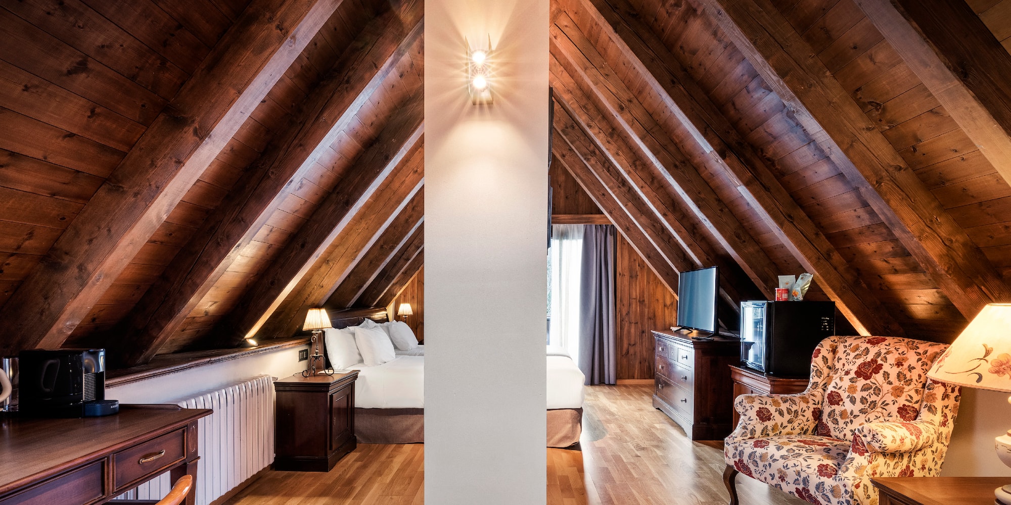 a room with a bed and a tv