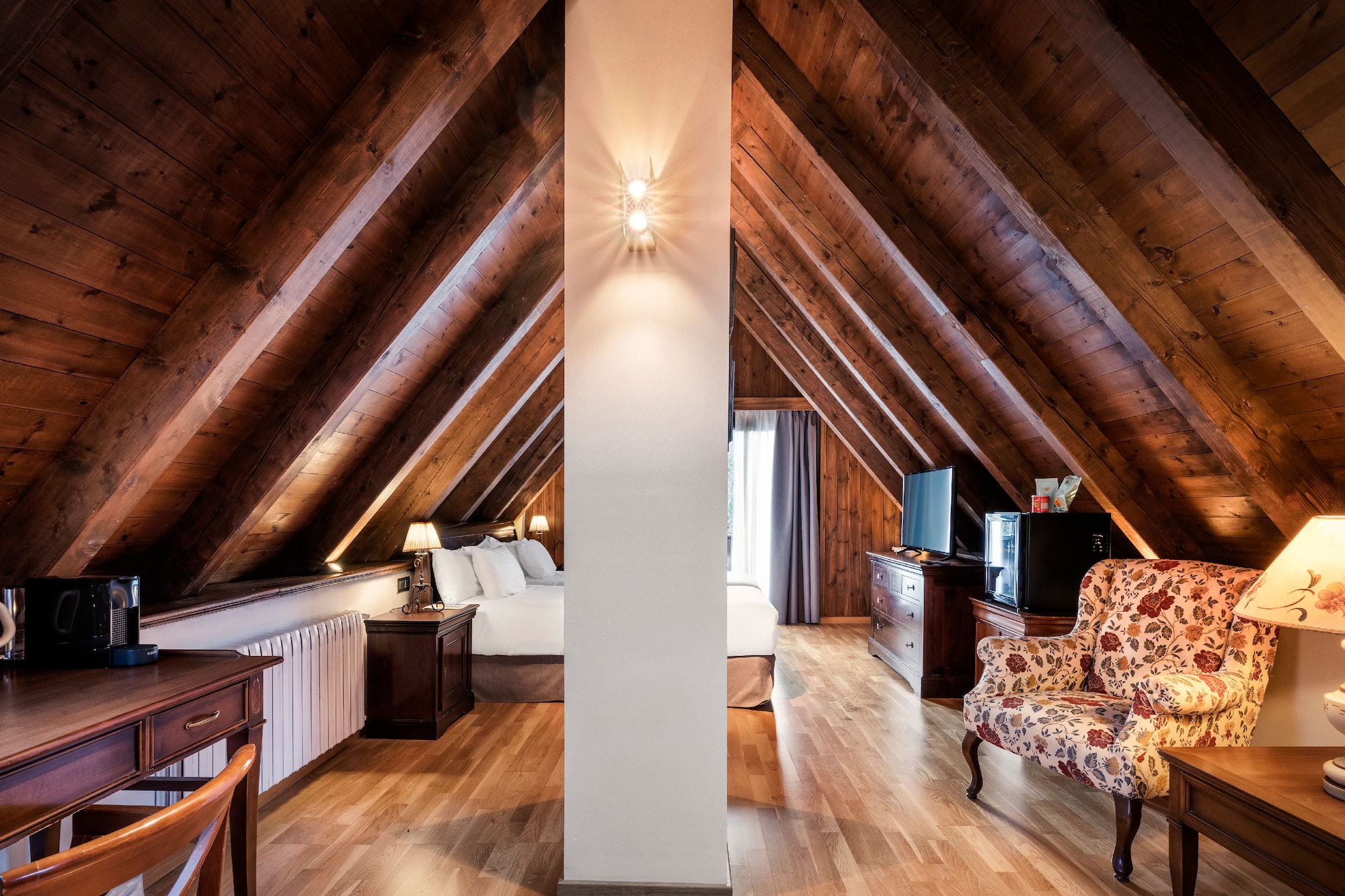 a room with a bed and a tv