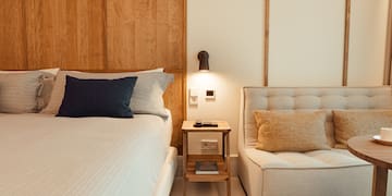 a bed and a chair in a room