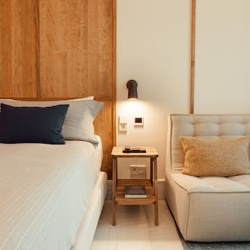 a bed and a chair in a room