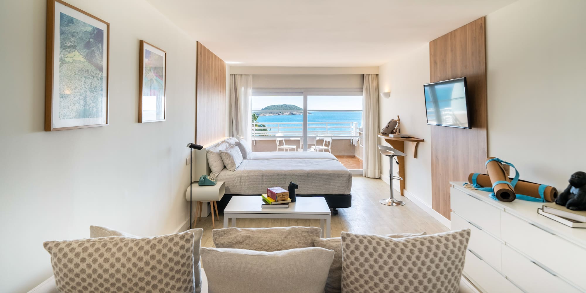 a room with a bed and a television