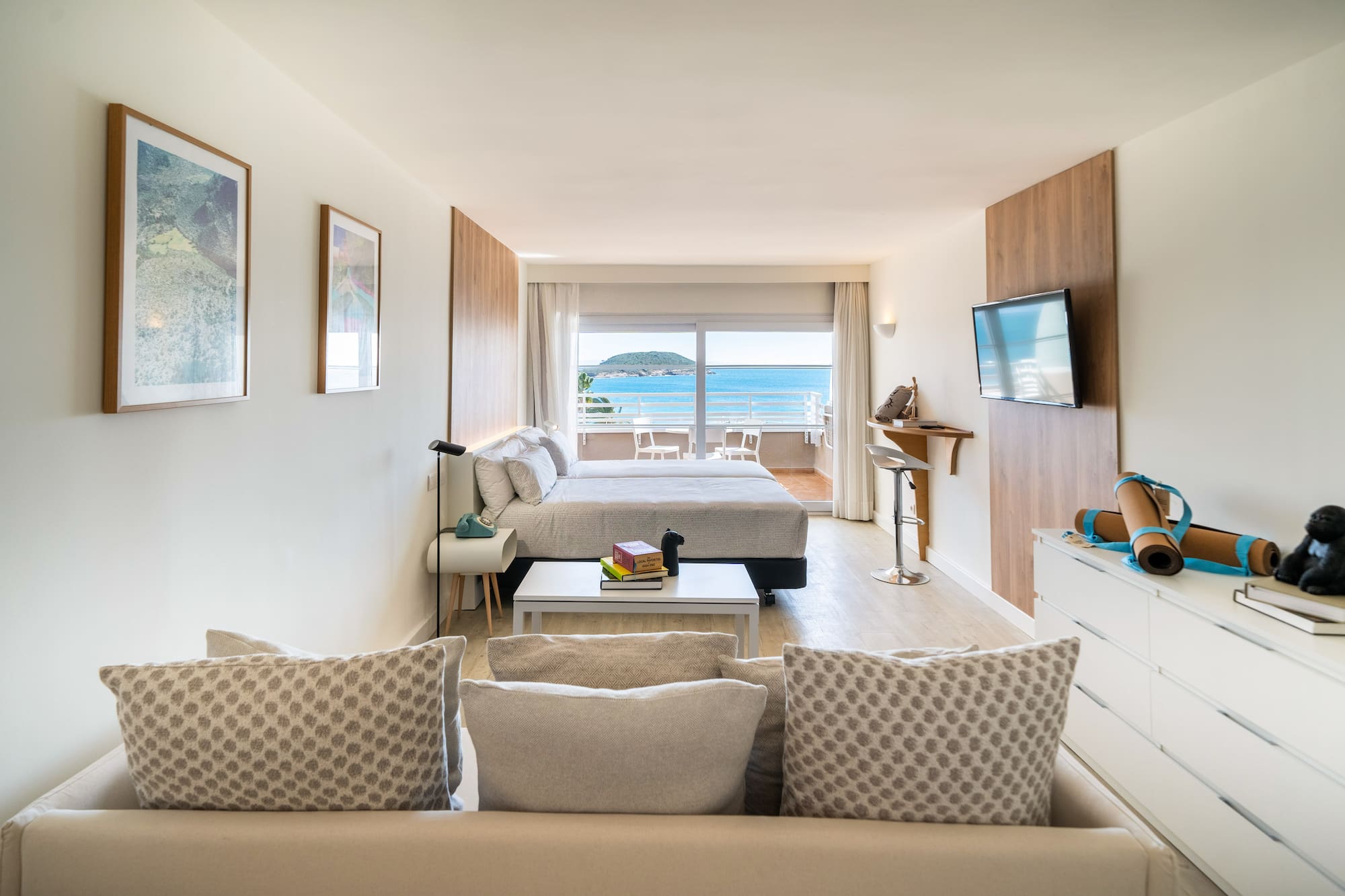 a room with a bed and a television