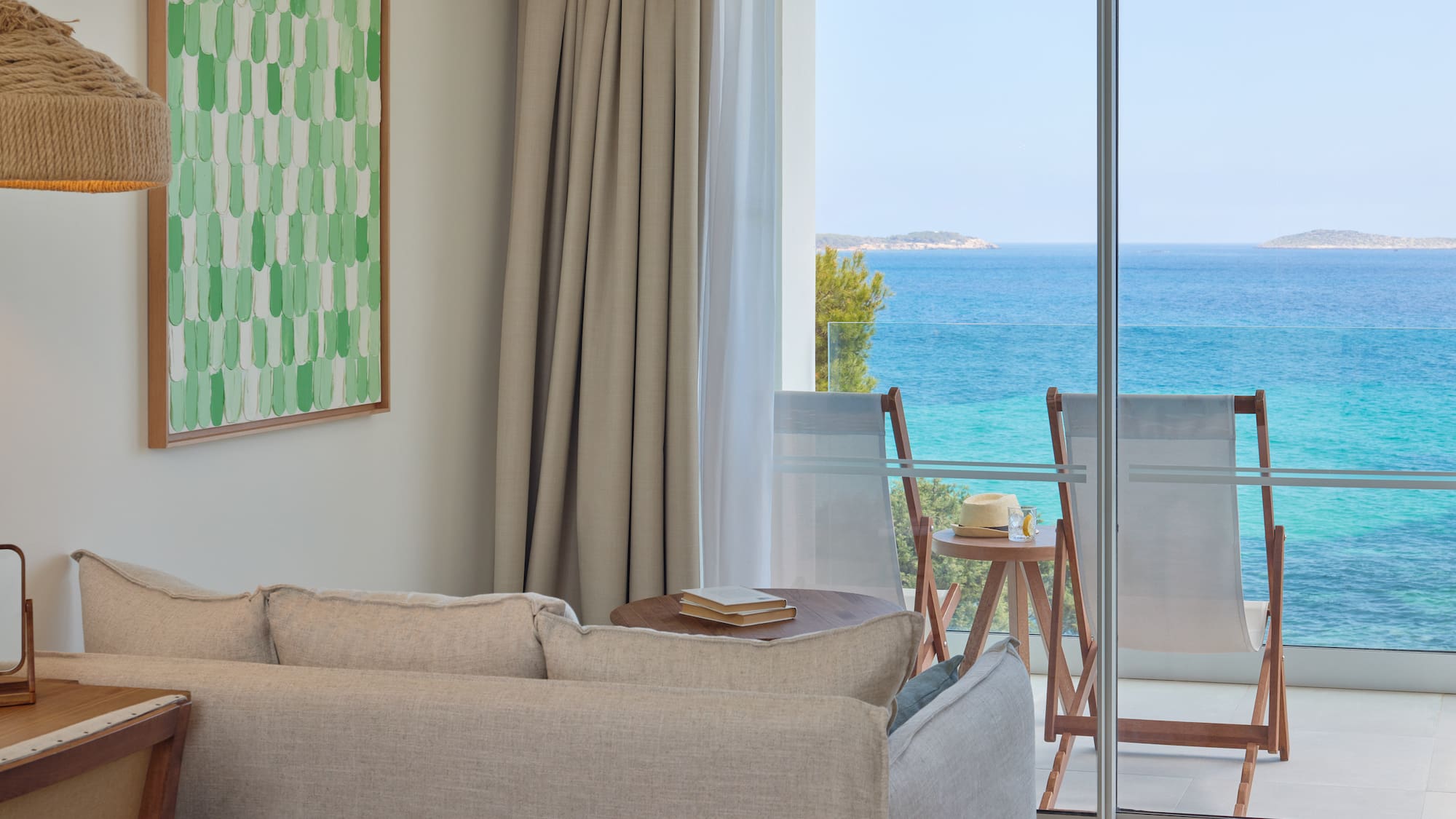 a living room with a view of the ocean