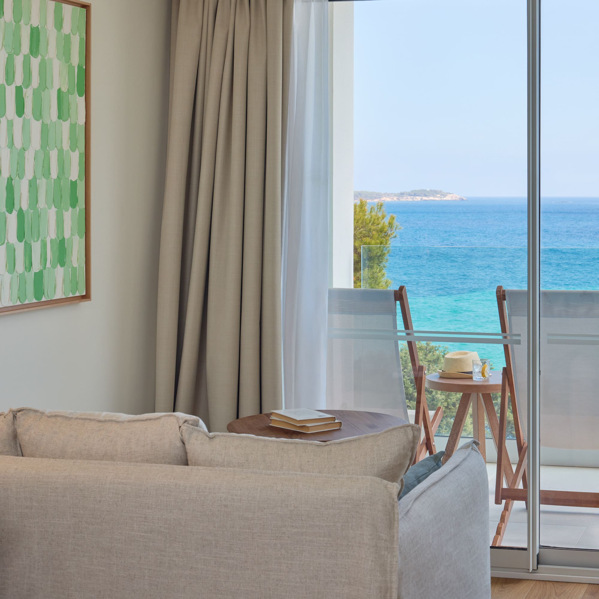 a living room with a view of the ocean