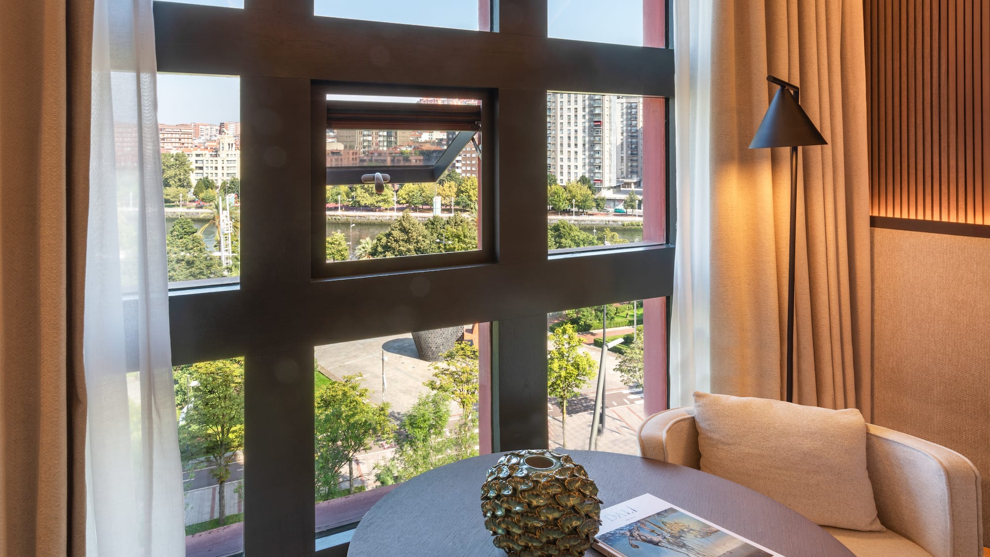 a room with a table and a lamp