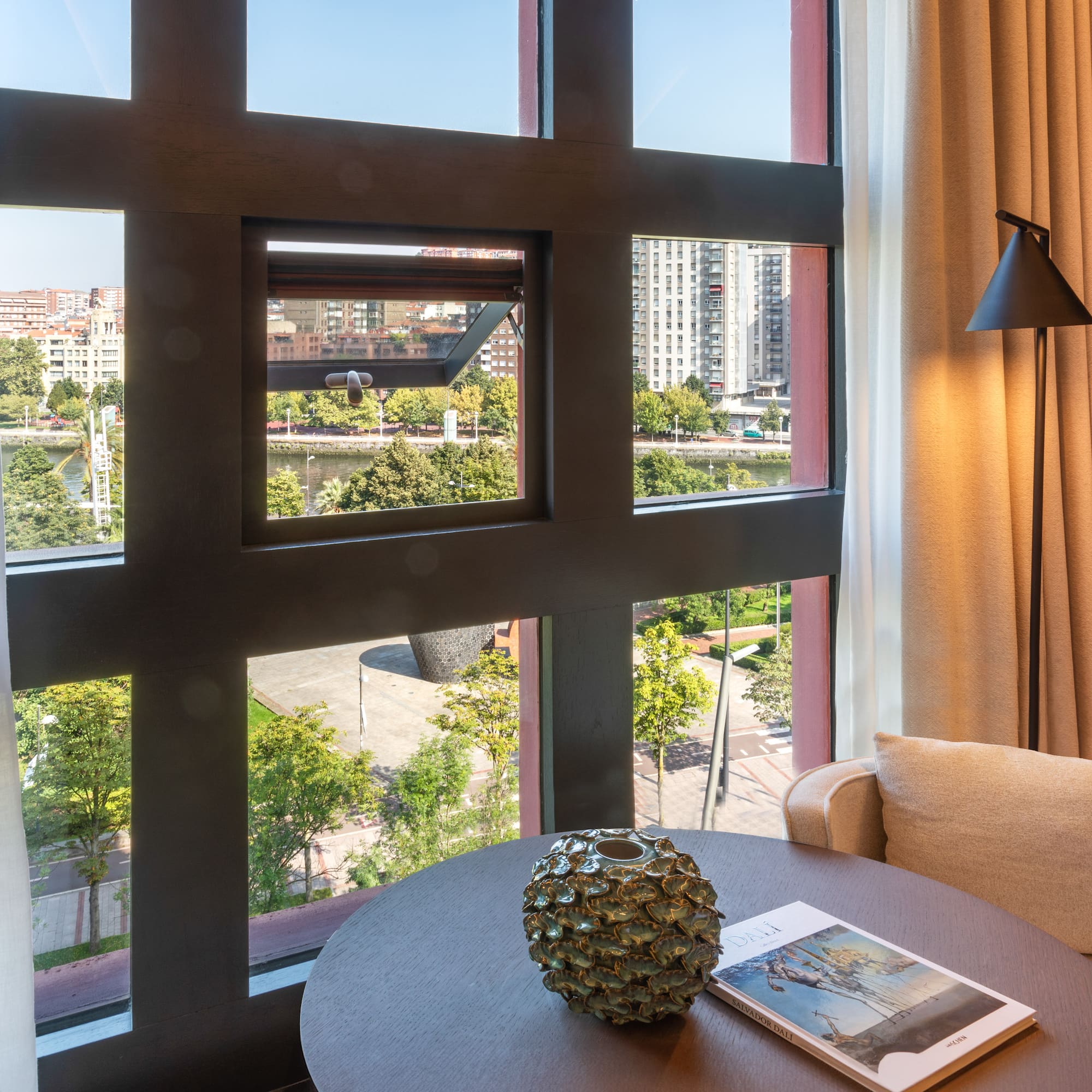 a room with a table and a lamp