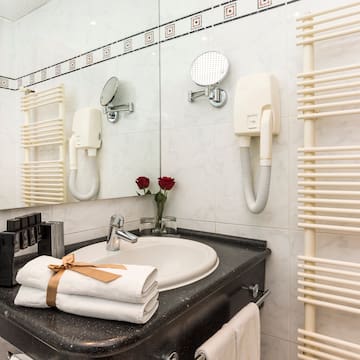 a bathroom with a sink and towels