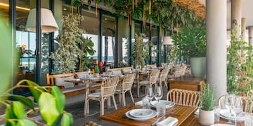 a restaurant with tables and chairs