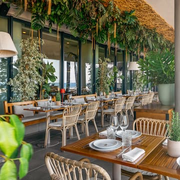 a restaurant with tables and chairs