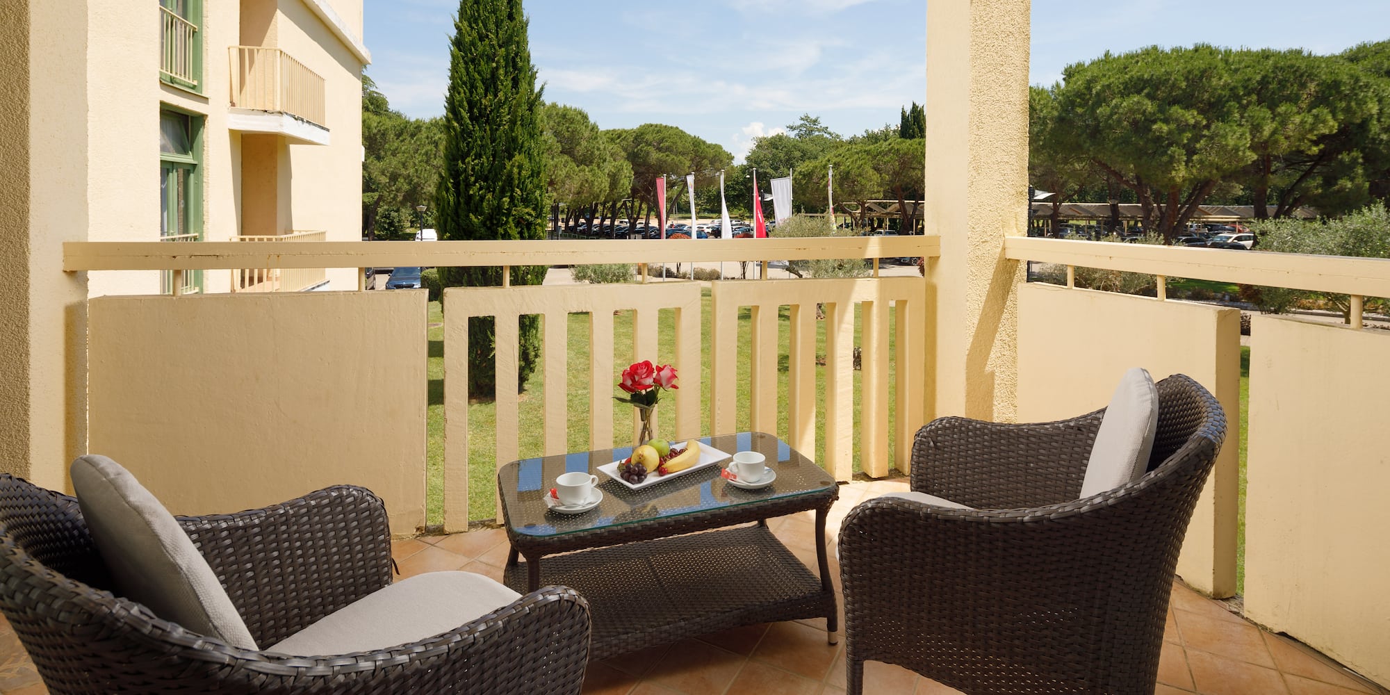 a table and chairs on a balcony