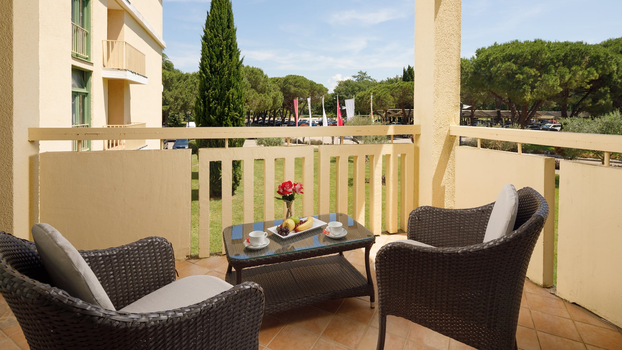 a table and chairs on a balcony
