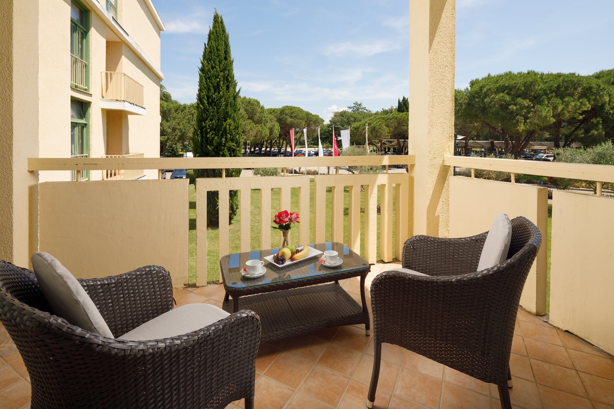 a table and chairs on a balcony