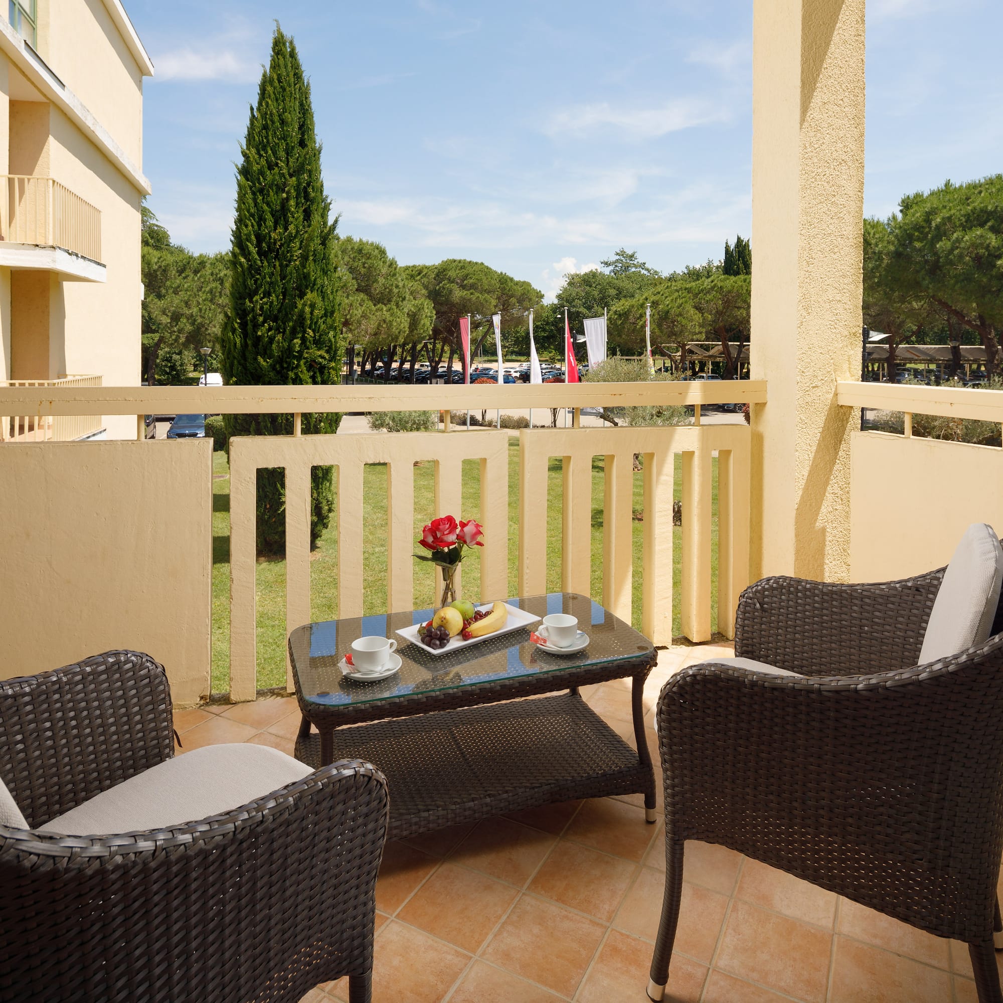 a table and chairs on a balcony