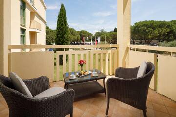 a table and chairs on a balcony