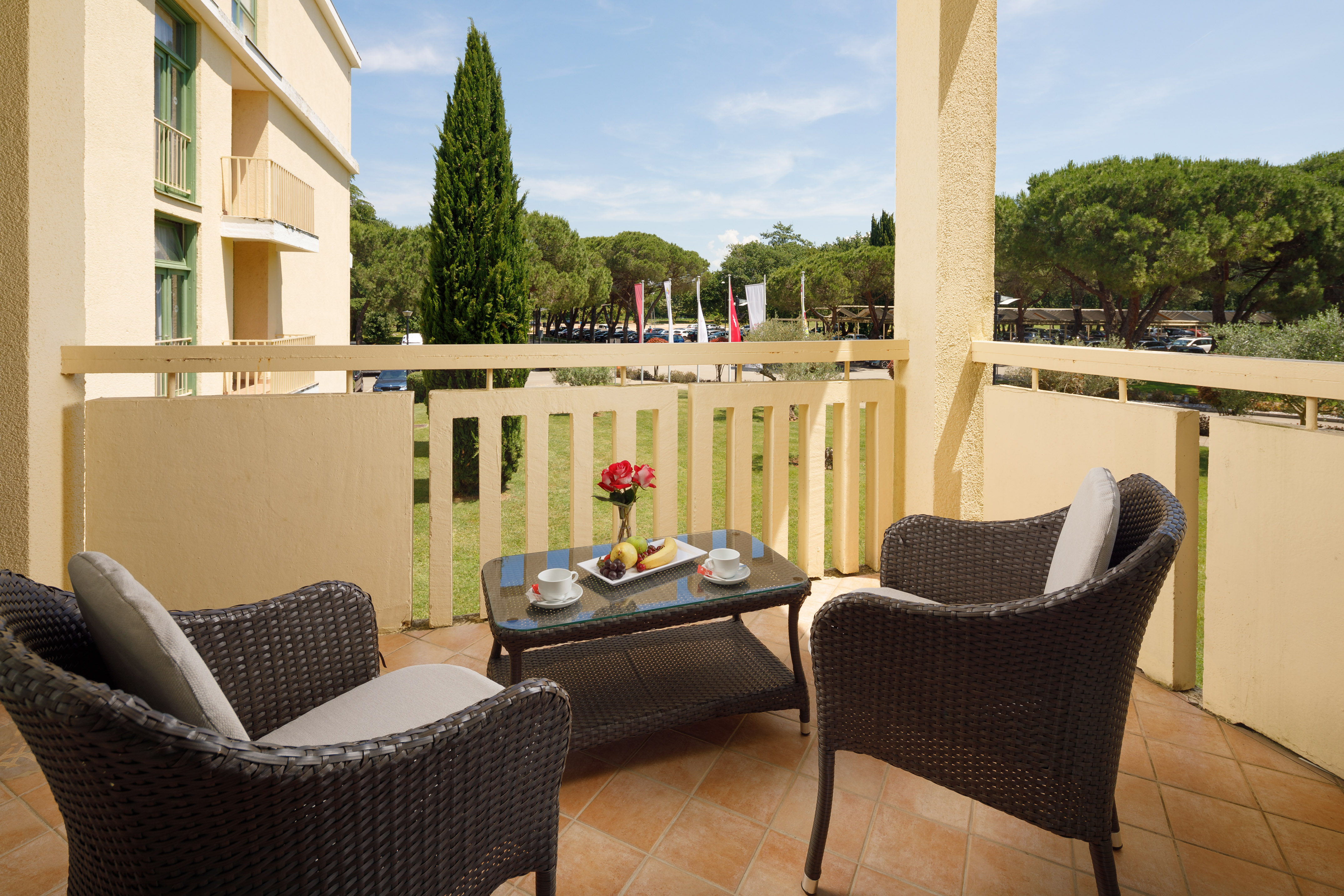 a table and chairs on a balcony