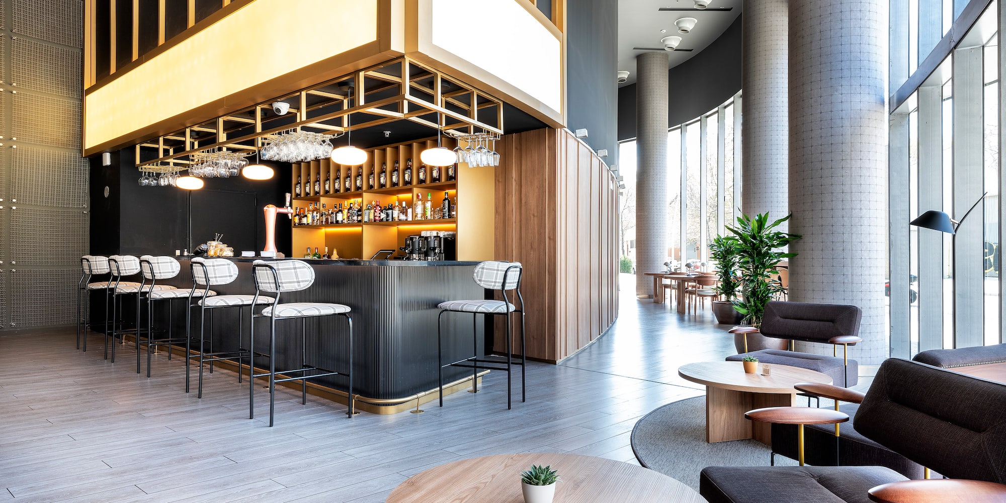 a room with a bar and chairs