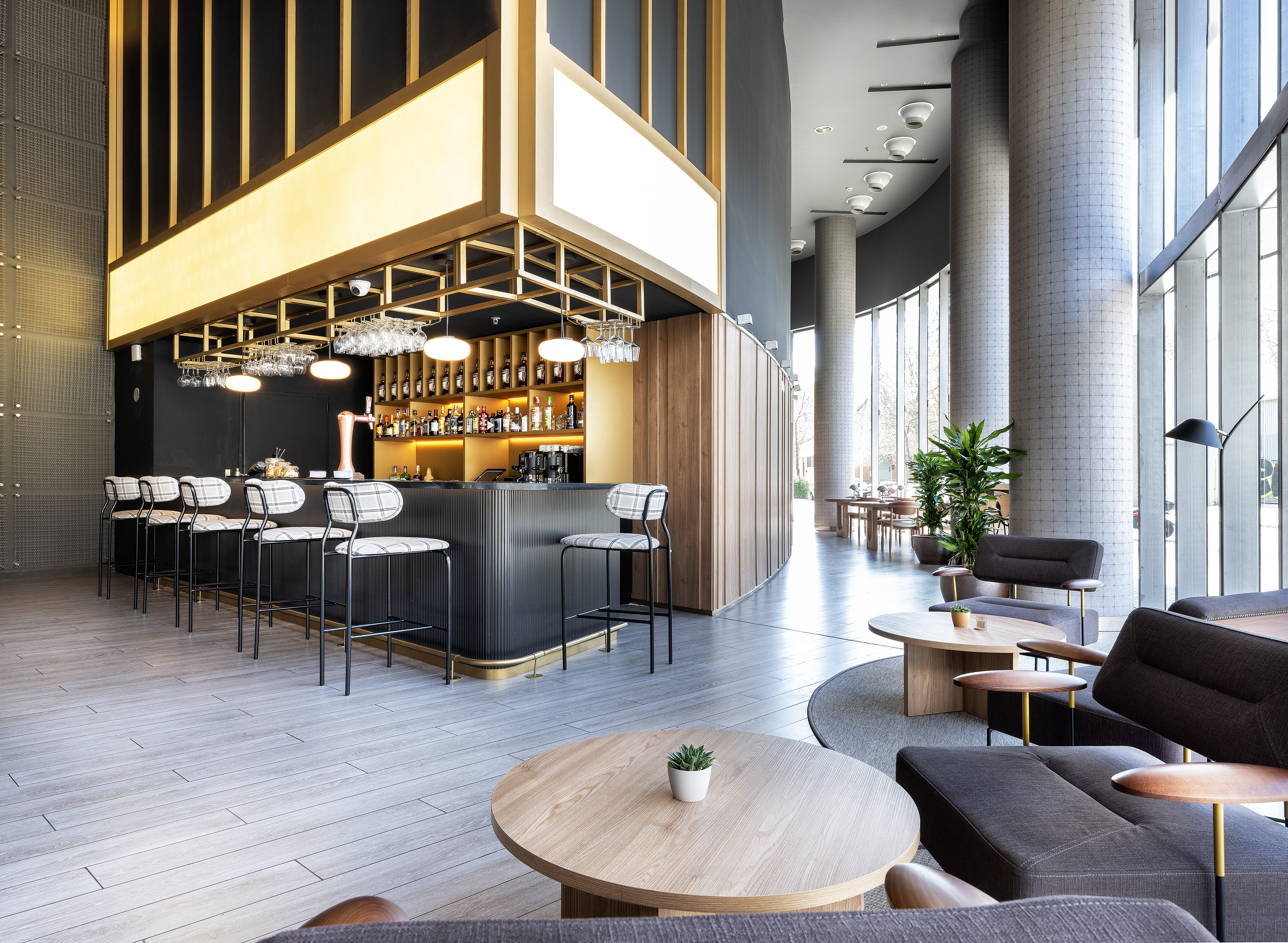 a room with a bar and chairs