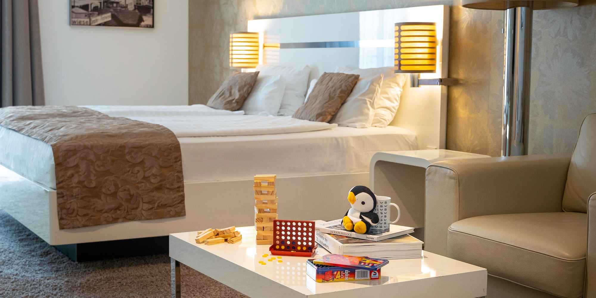 a room with a bed and a table with toys