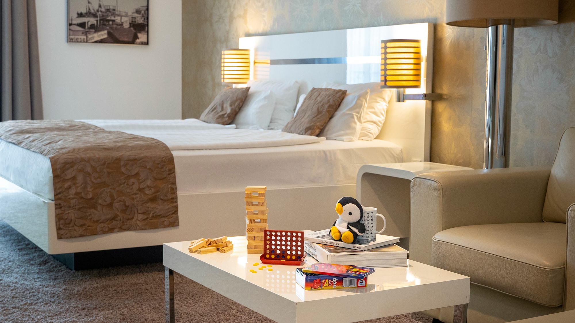 a room with a bed and a table with toys