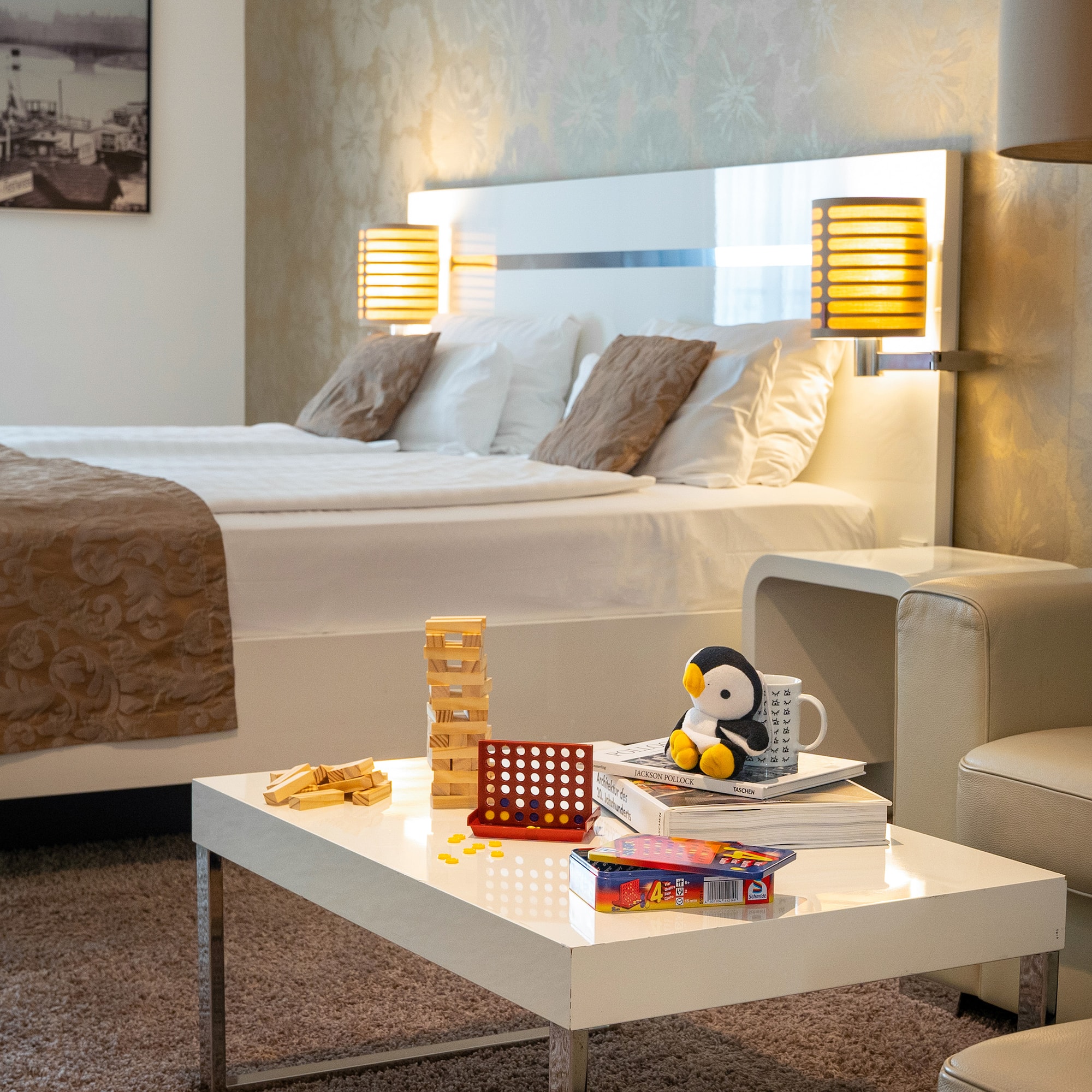 a room with a bed and a table with toys