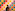 a person stands before a wall of vibrant squares