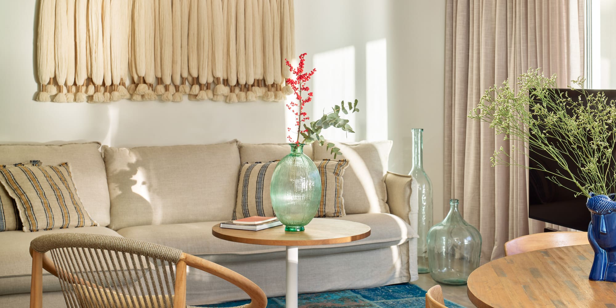 a living room with a couch and chairs