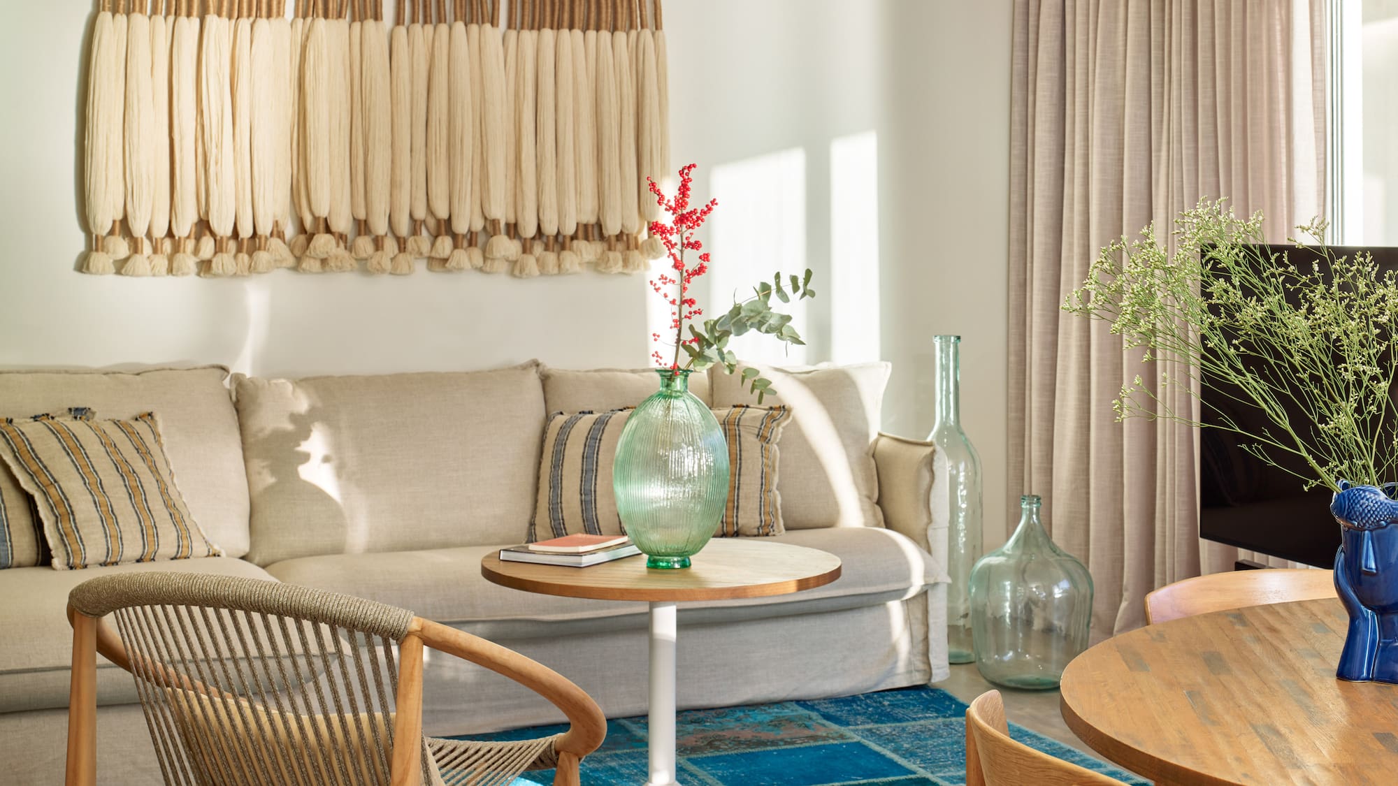 a living room with a couch and chairs