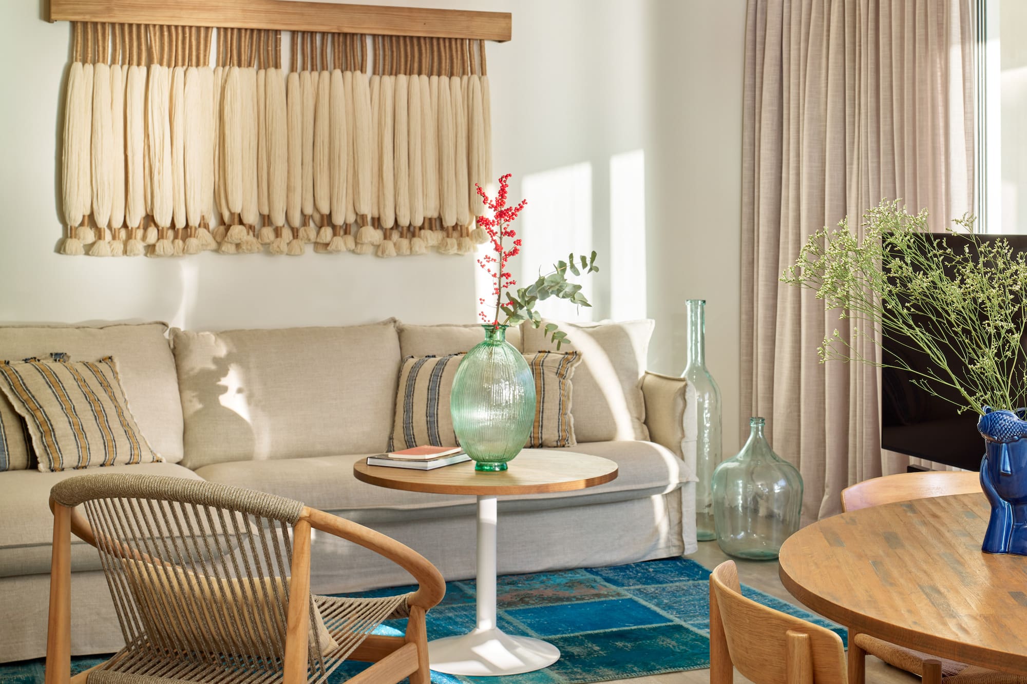 a living room with a couch and chairs