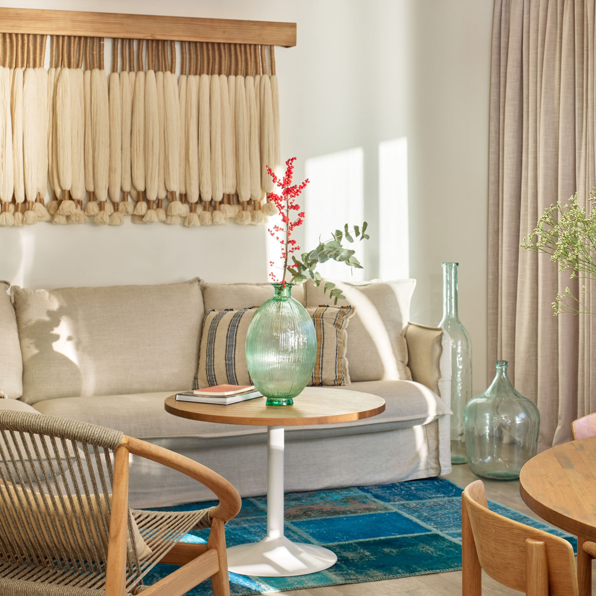 a living room with a couch and chairs