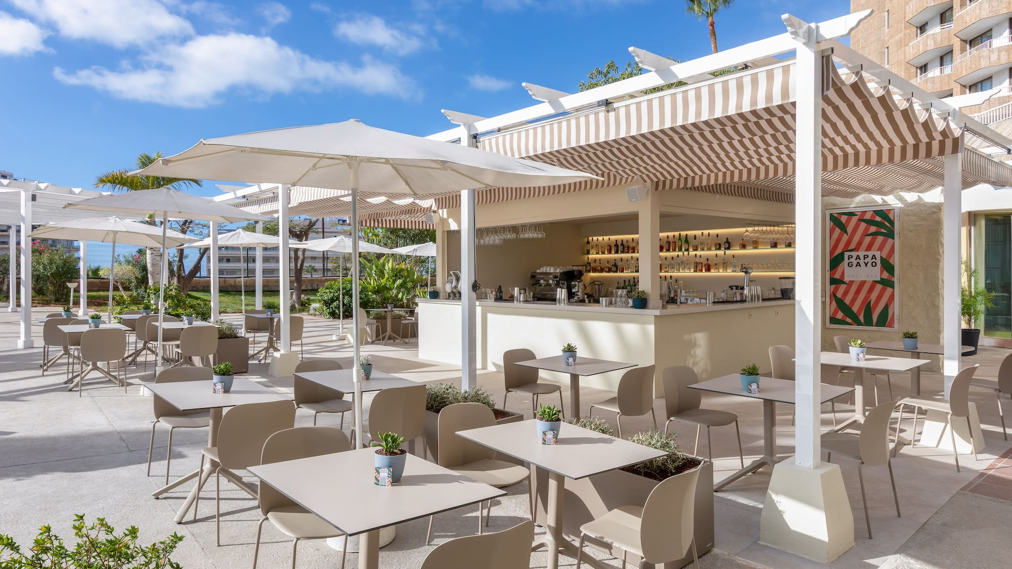 a patio with tables and chairs