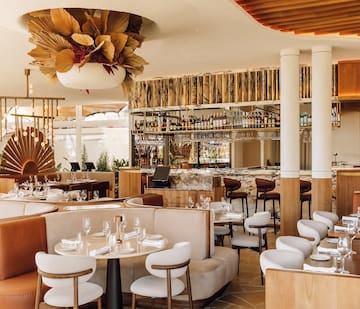 a restaurant with tables and chairs