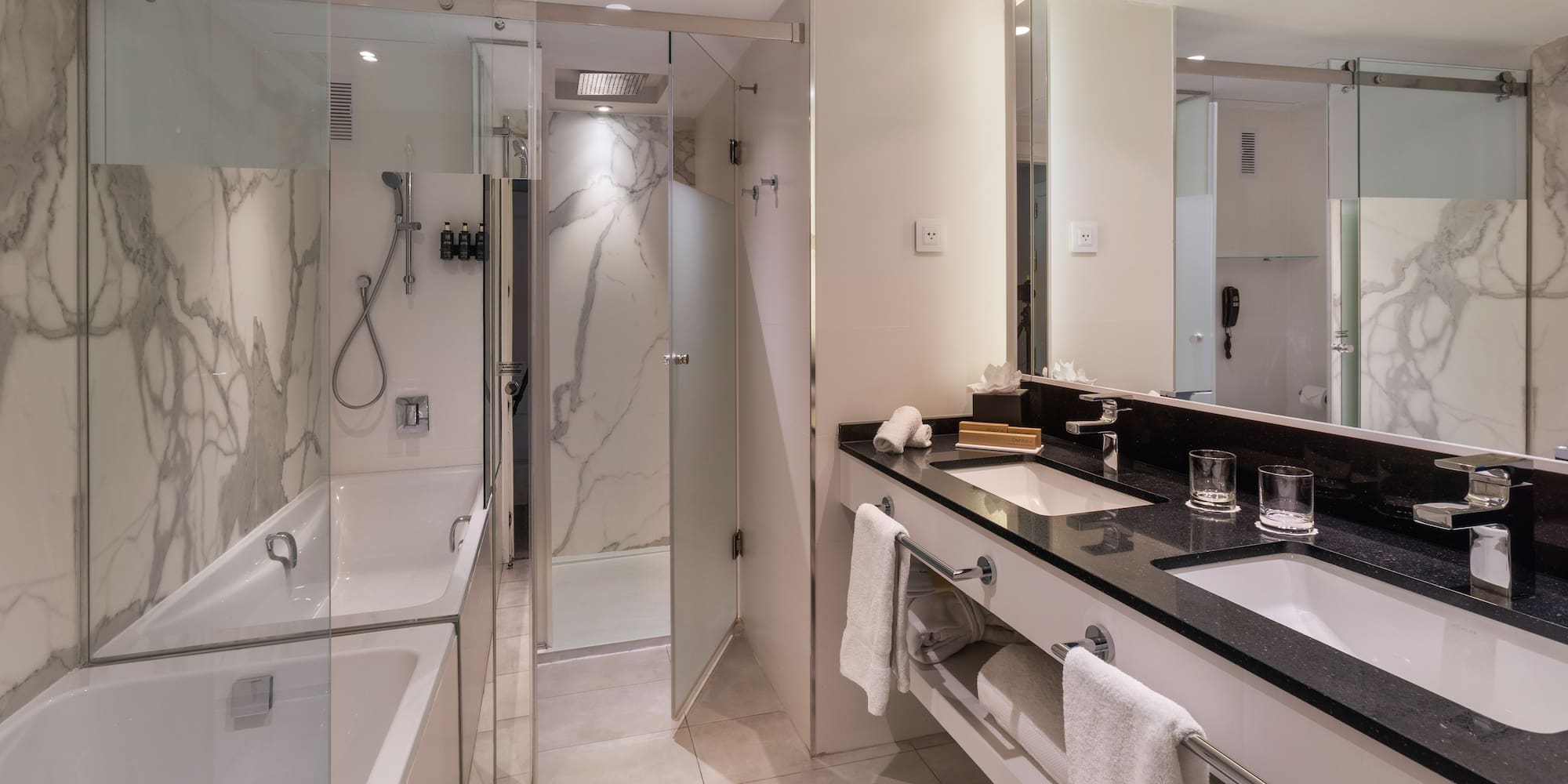 a bathroom with a shower and sink