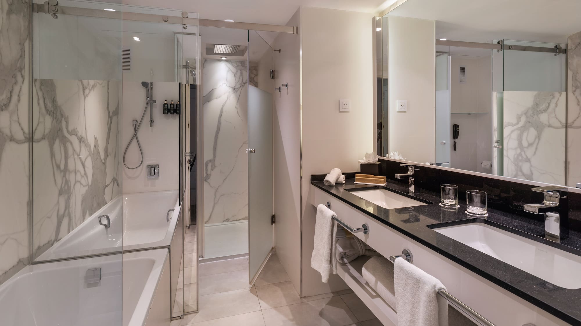 a bathroom with a shower and sink