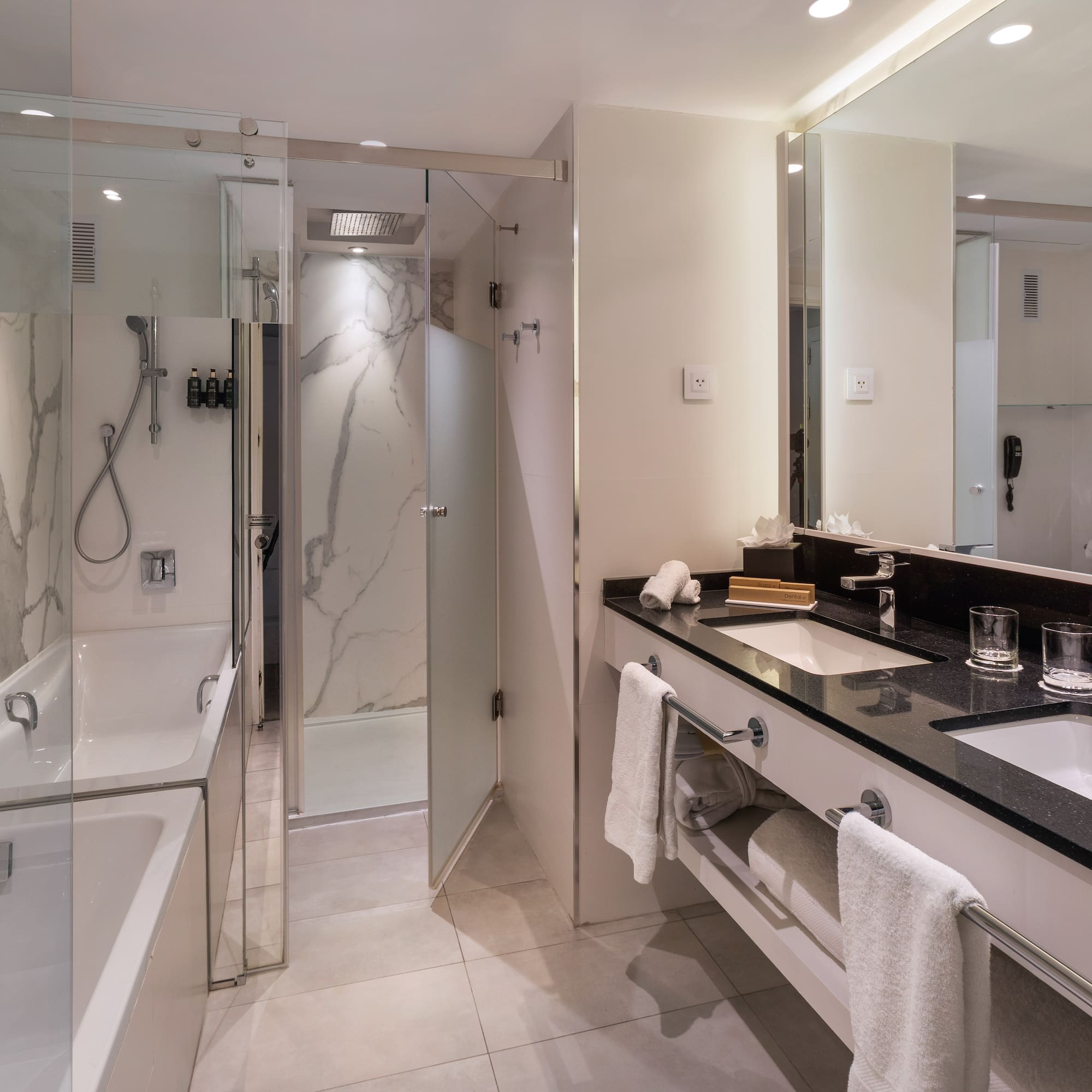 a bathroom with a shower and sink