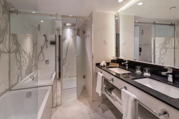 a bathroom with a shower and sink
