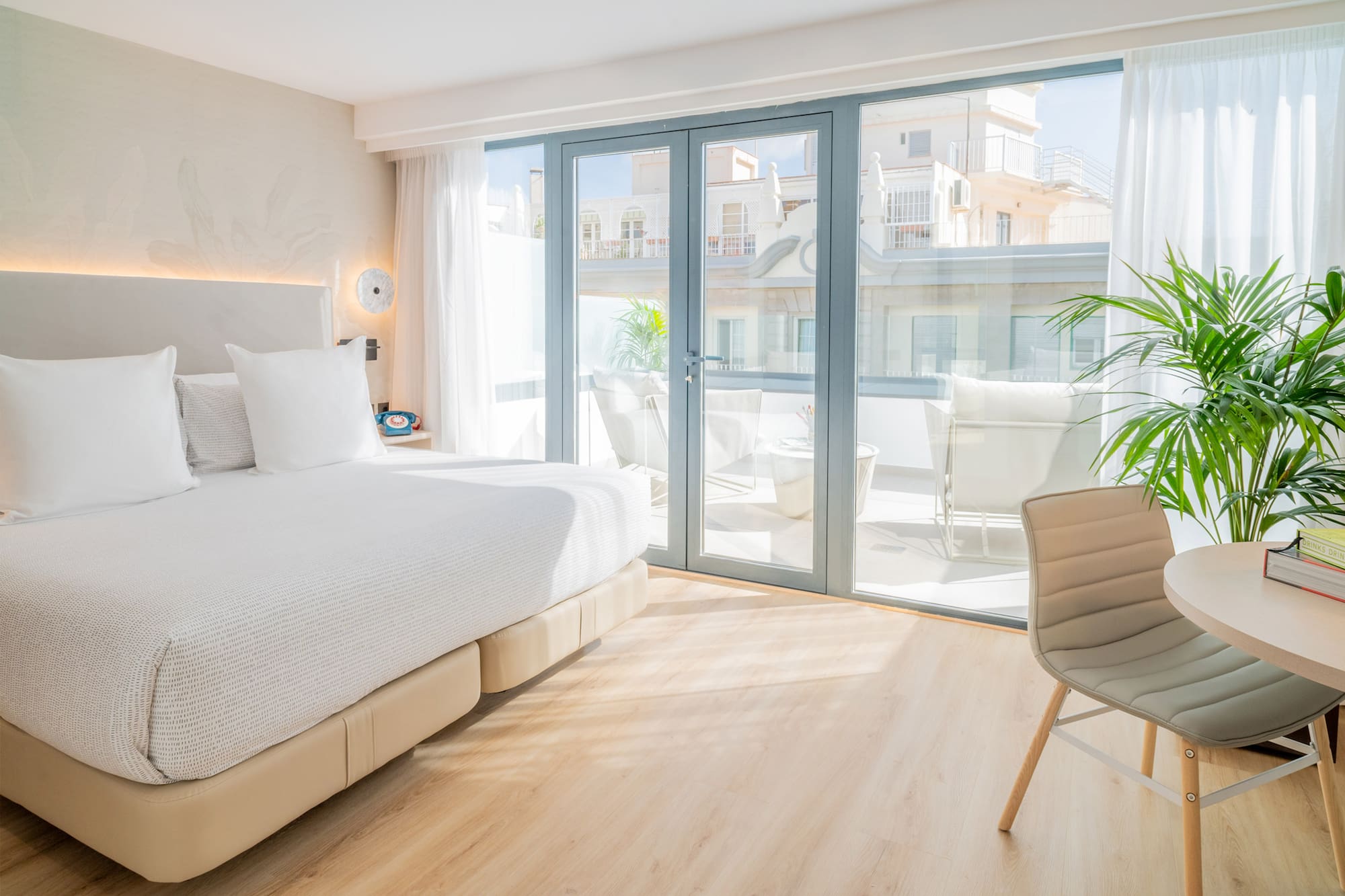 a bedroom with a large bed and a chair