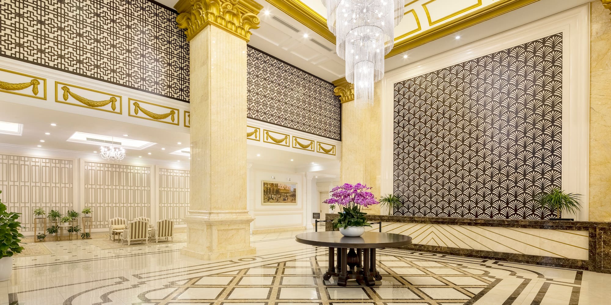 a large room with a chandelier and flowers