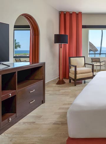 a room with a television and a chair