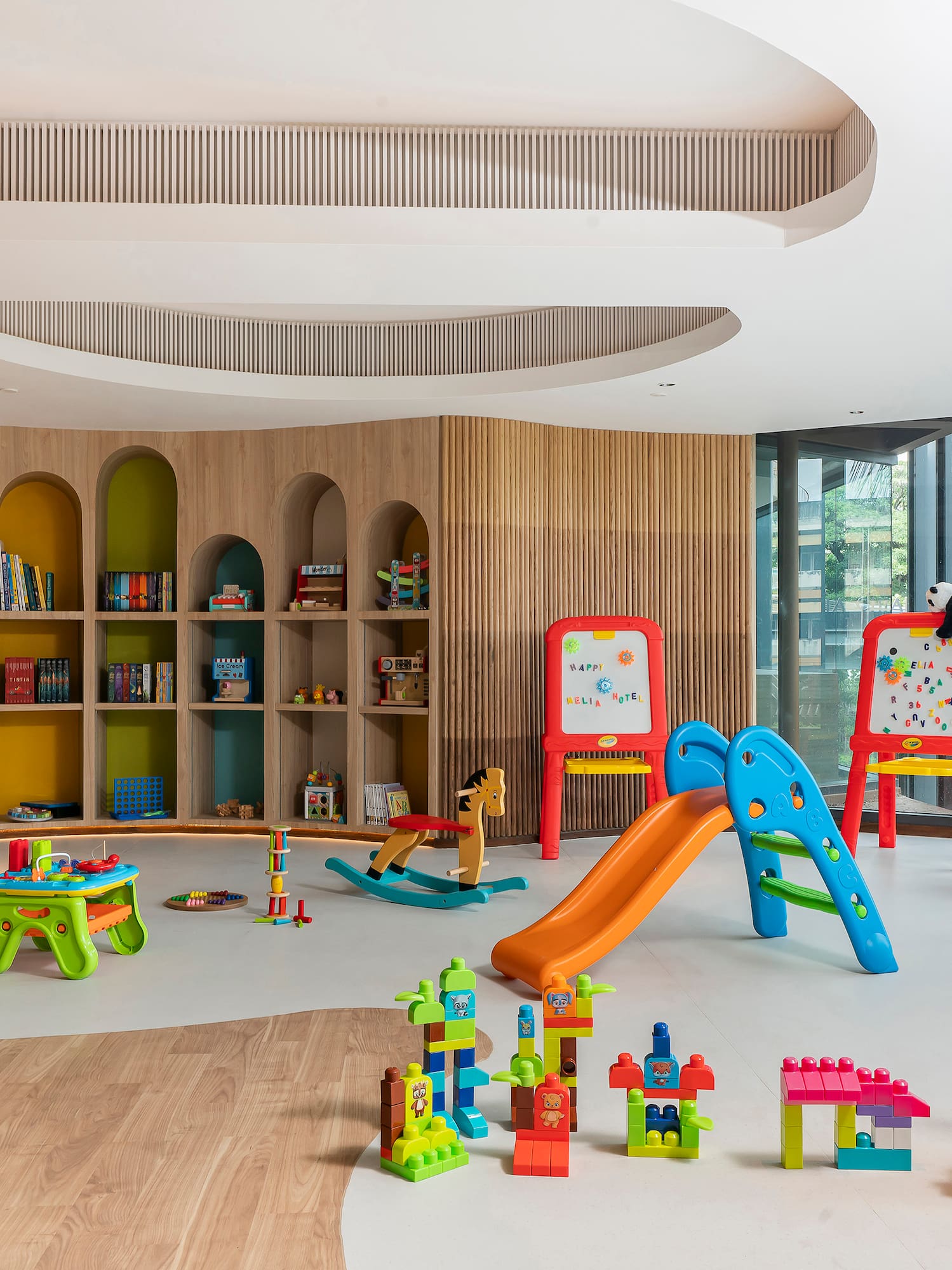 a room with toys and bookshelves
