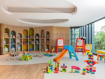 a room with toys and bookshelves