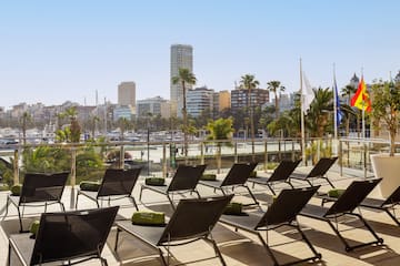 a group of lounge chairs on a deck