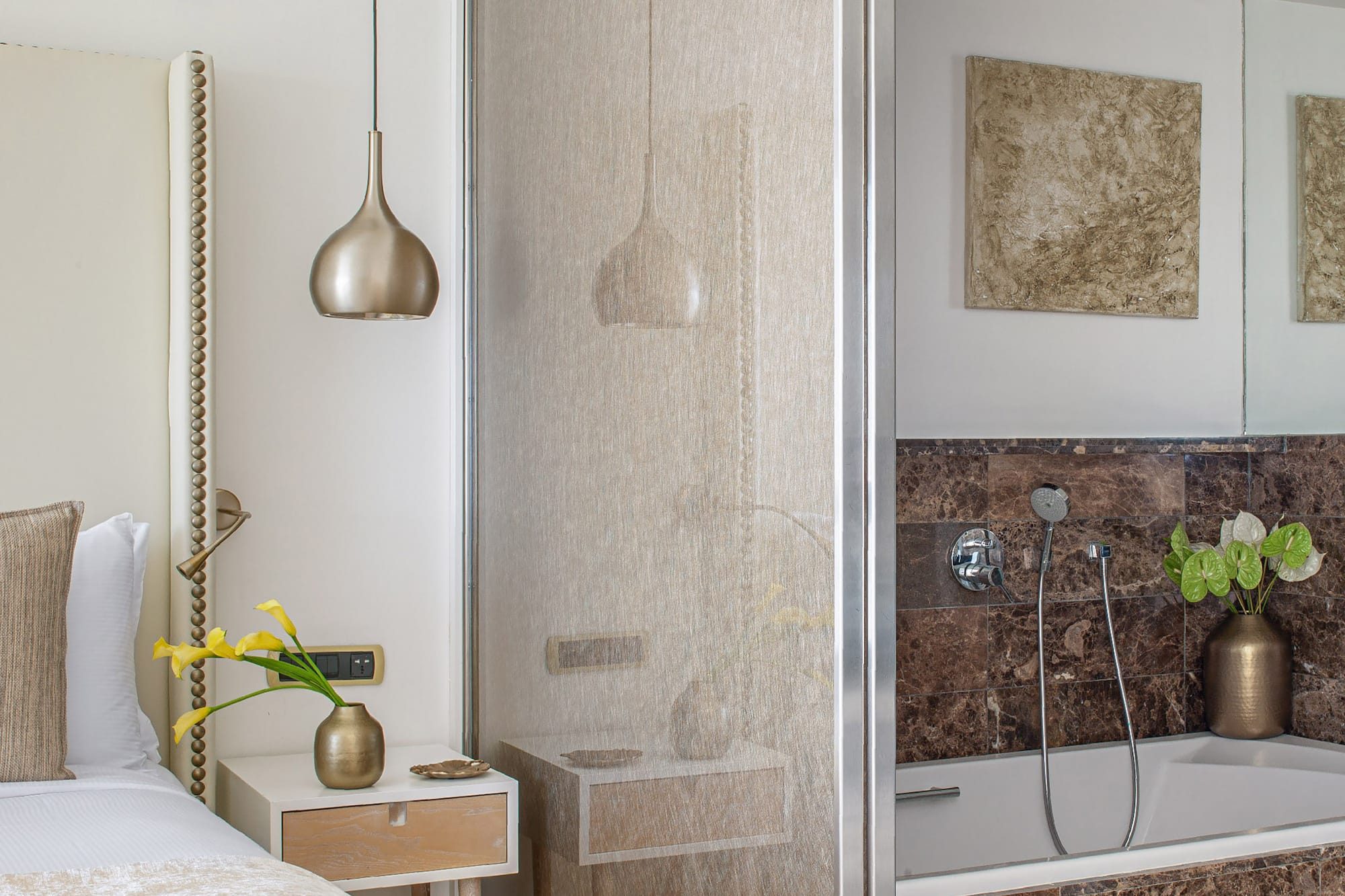 a bathroom with a shower and a bed