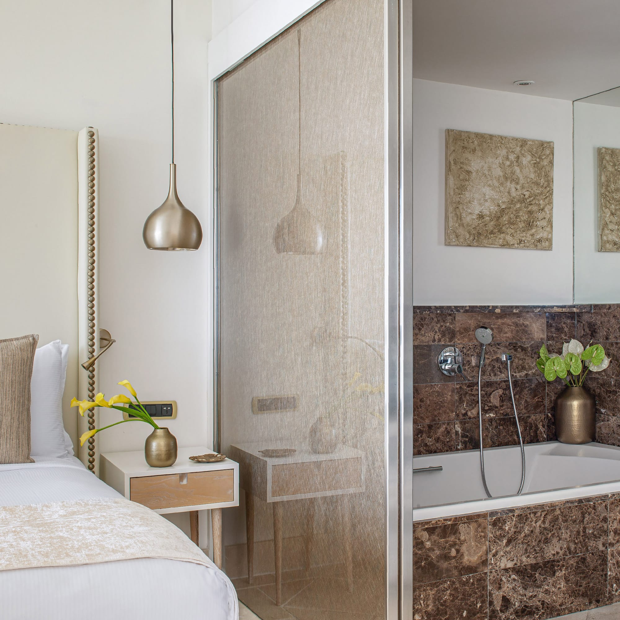 a bathroom with a shower and a bed