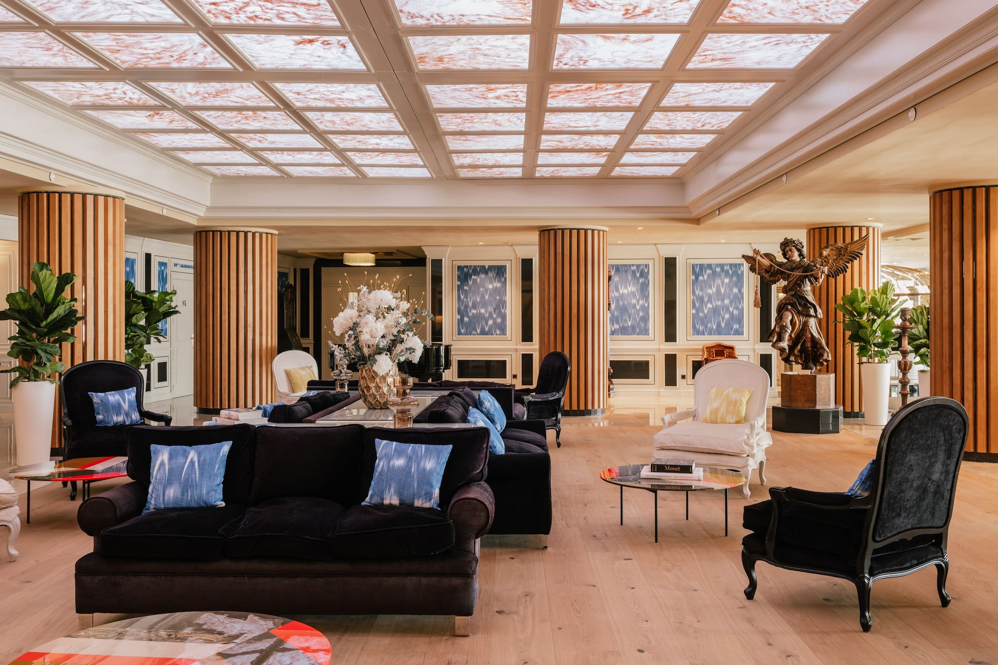 a large room with a large ceiling and a large table and chairs