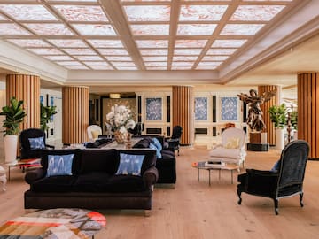 a large room with a large ceiling and a large table and chairs