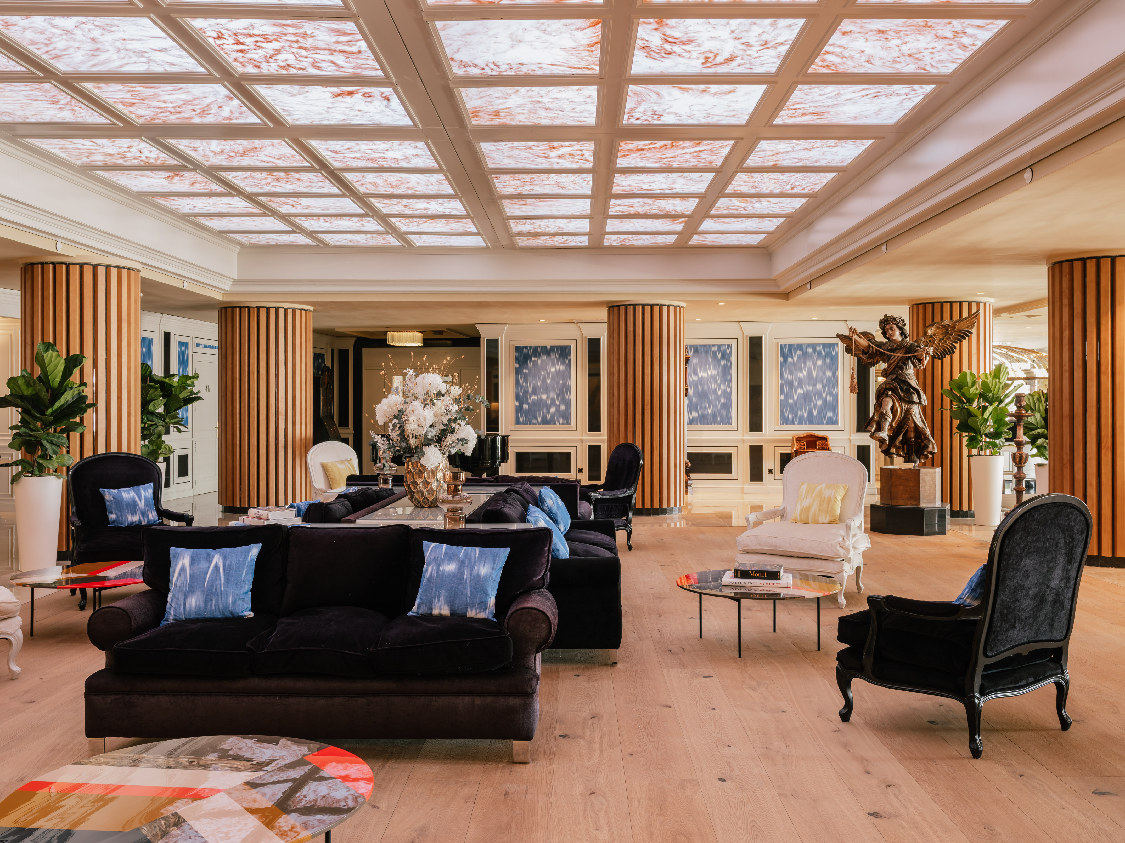 a large room with a large ceiling and a large table and chairs